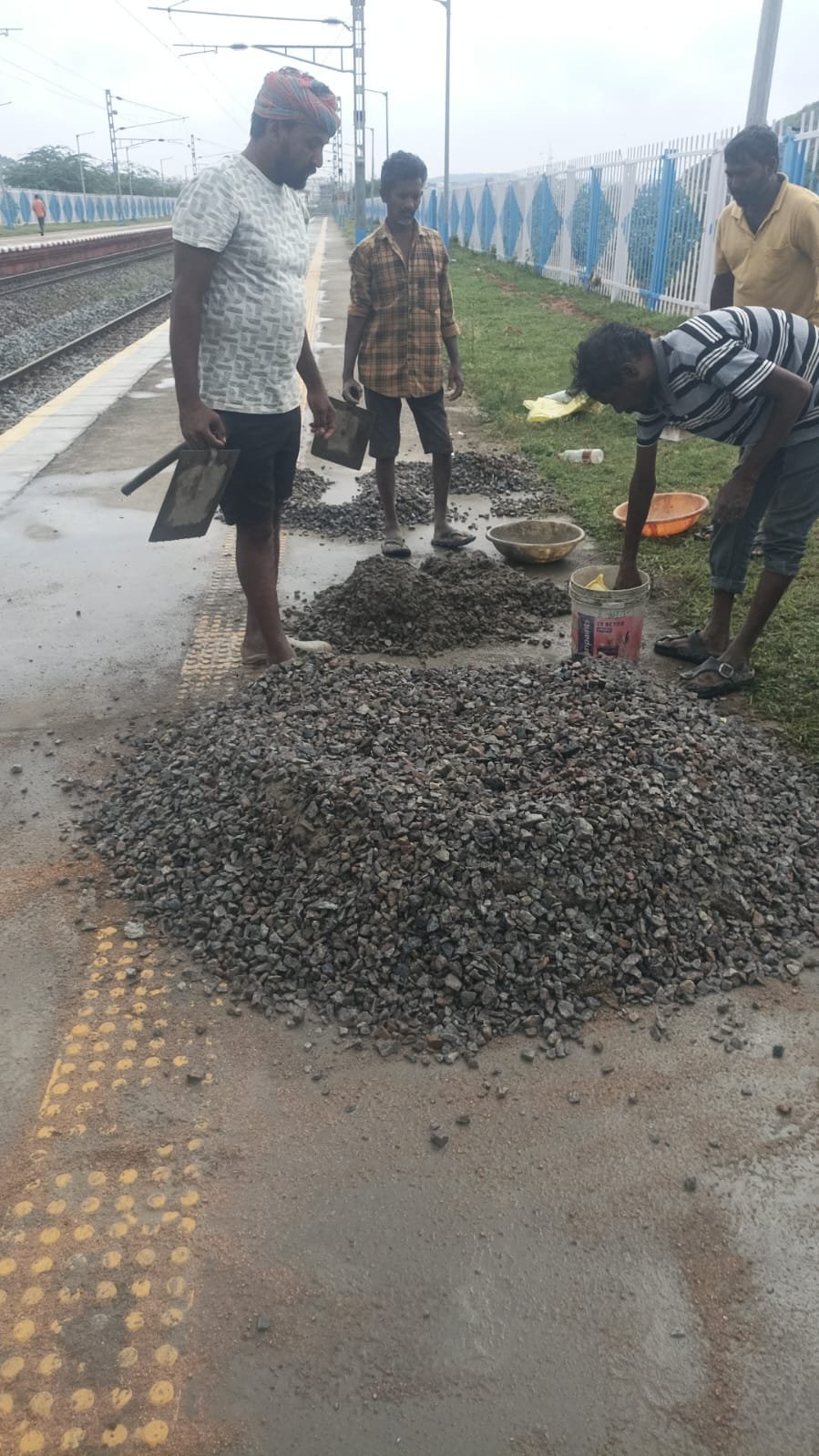 Manpower team working at railway station platform